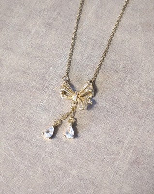 Beautiful Hanging Gem/Jeweled Bow Pendant Gold Plated Stainless Steel 